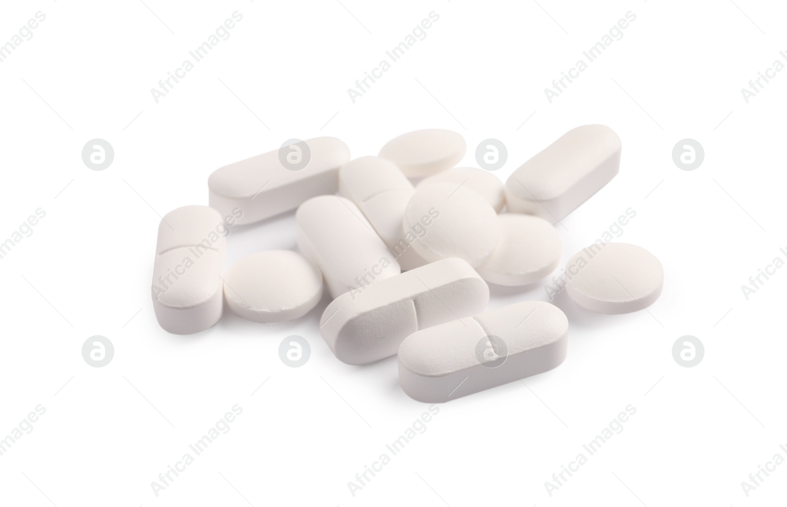 Photo of Many pills isolated on white. Medicinal treatment