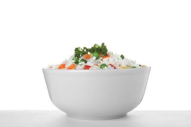 Photo of Bowl with tasty rice and vegetables on white background