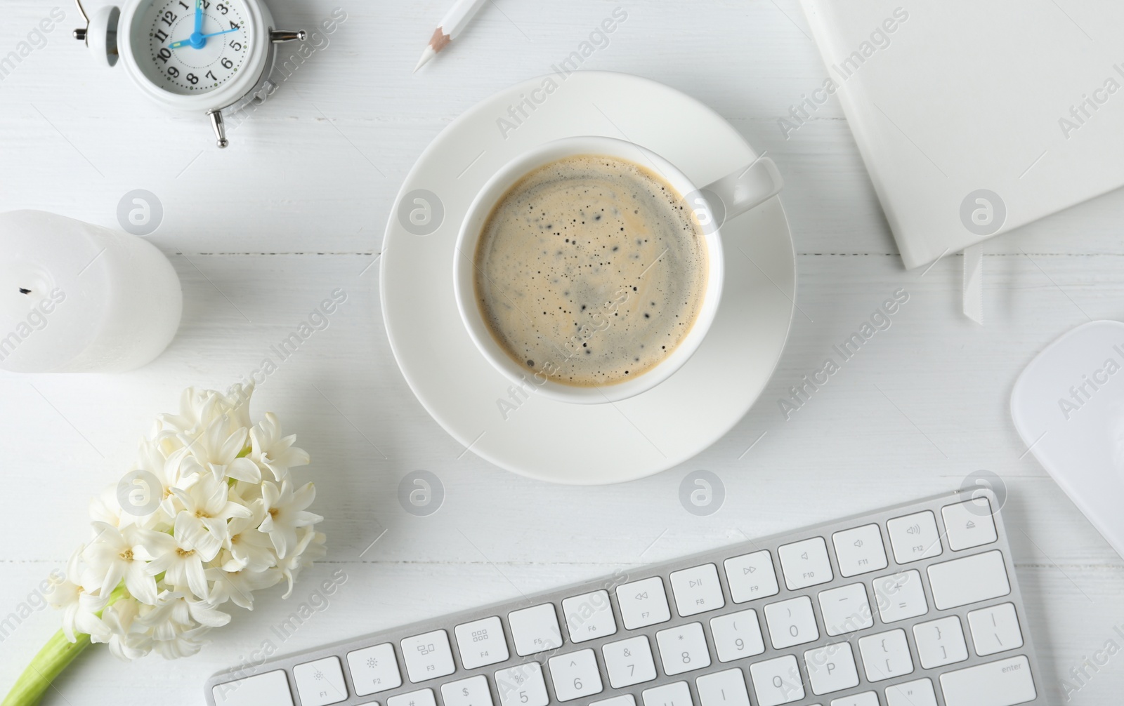 Photo of Flat lay composition with keyboard, coffee and flower on white wooden table