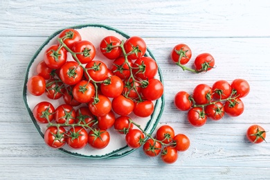 Flat lay composition with ripe tomatoes on wooden background