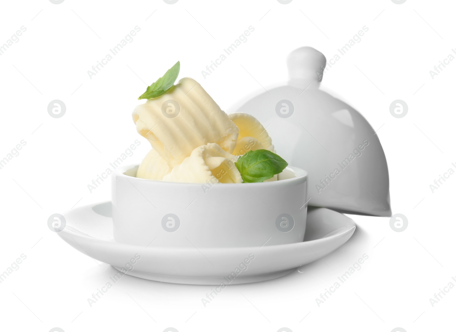 Photo of Dish with tasty butter curls on white background