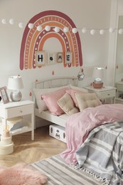 Photo of Stylish child's room interior with comfortable bed