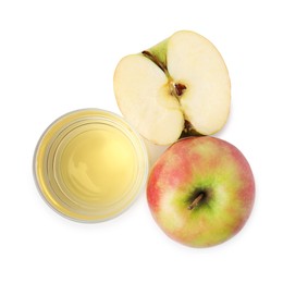 Photo of Apple vinegar in glass and fruits isolated on white, top view