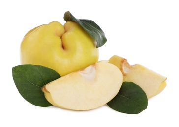 Photo of Ripe fresh quinces with green leaves on white background