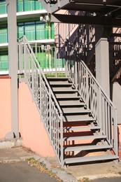 Photo of View of beautiful metal stairs with railings outdoors