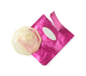 Unpacked female condom and torn package isolated on white, top view. Safe sex