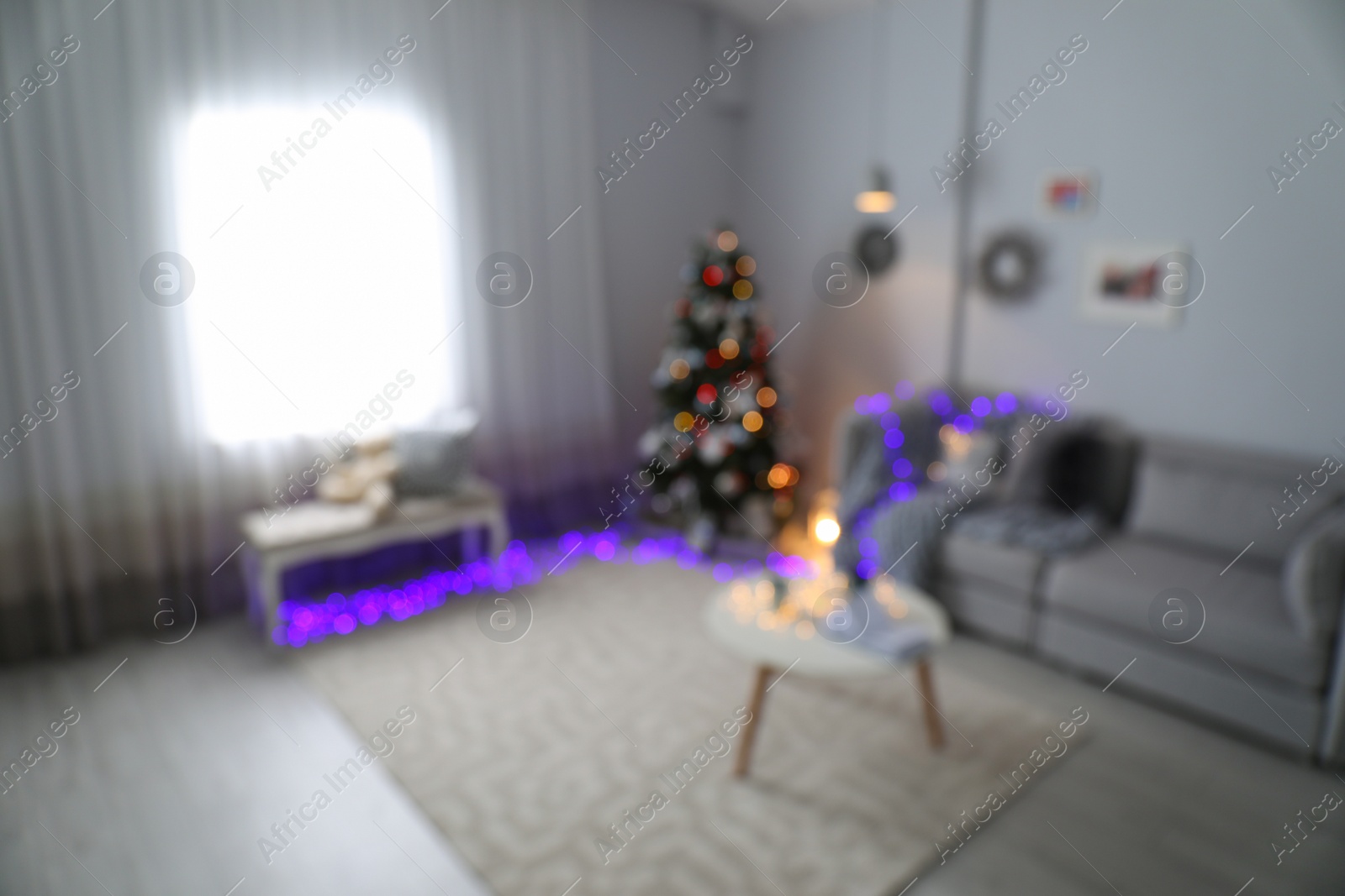 Photo of Blurred view of living room with beautiful Christmas tree