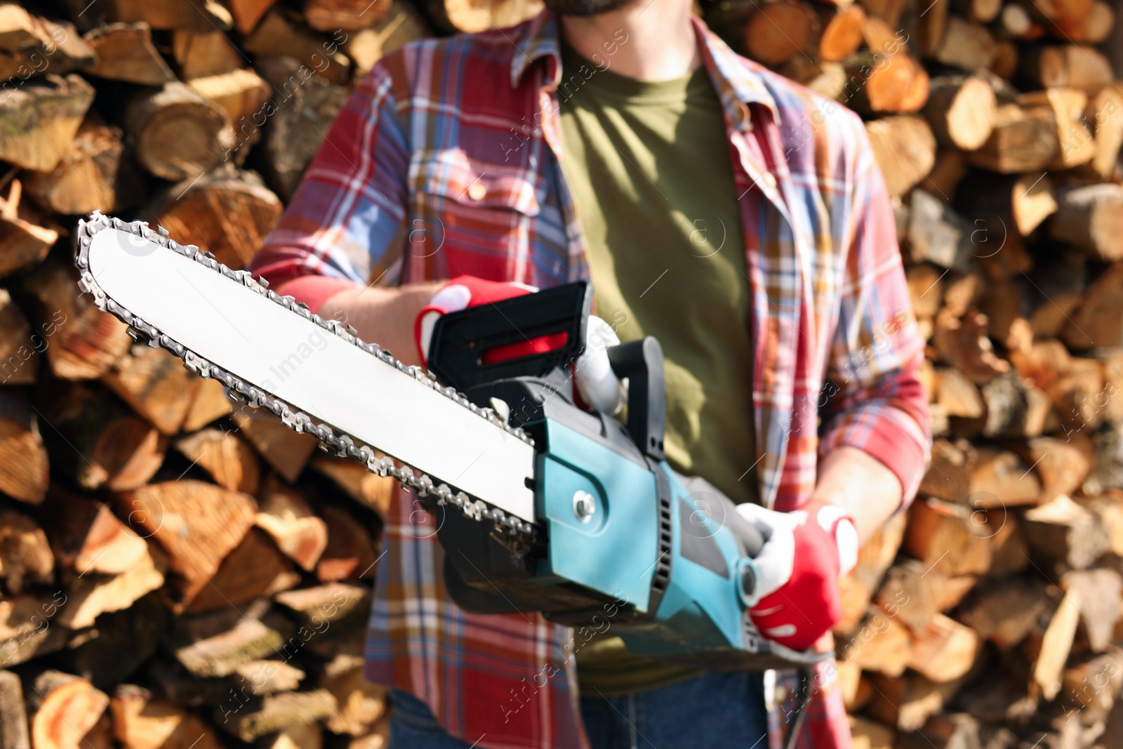 Photo of Man with modern saw on sunny day, closeup