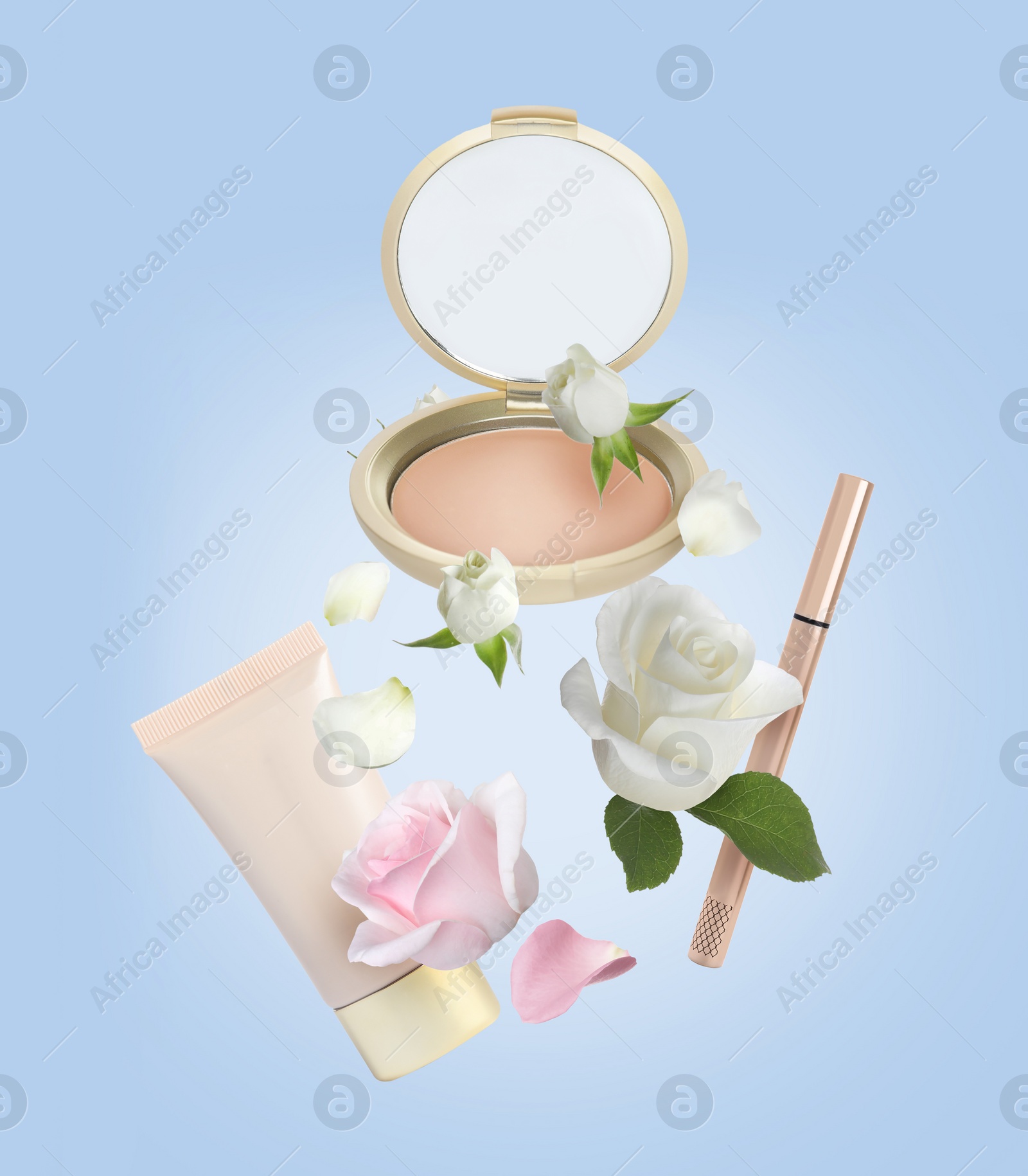 Image of Different makeup products and beautiful roses in air on light blue background