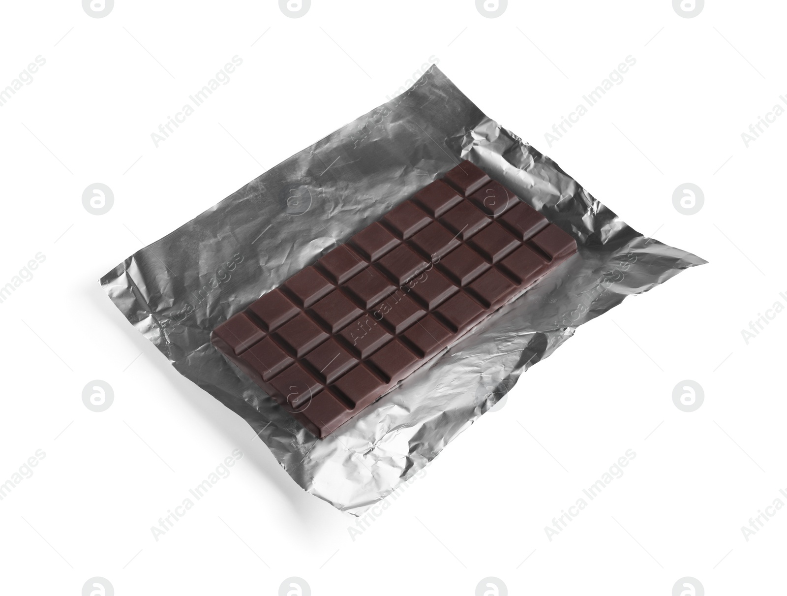 Photo of Delicious dark chocolate bar with foil isolated on white