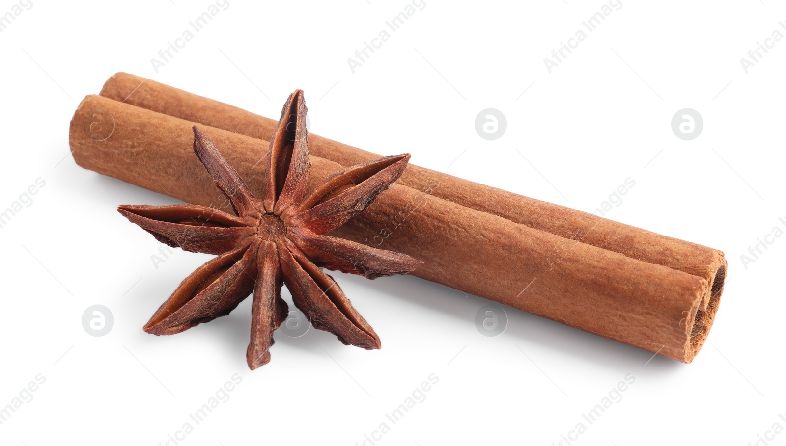 Photo of Aromatic cinnamon stick and anise star isolated on white