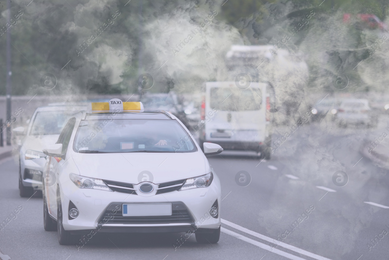 Image of Environmental pollution. Air contaminated with fumes in city. Cars surrounded by exhaust on road