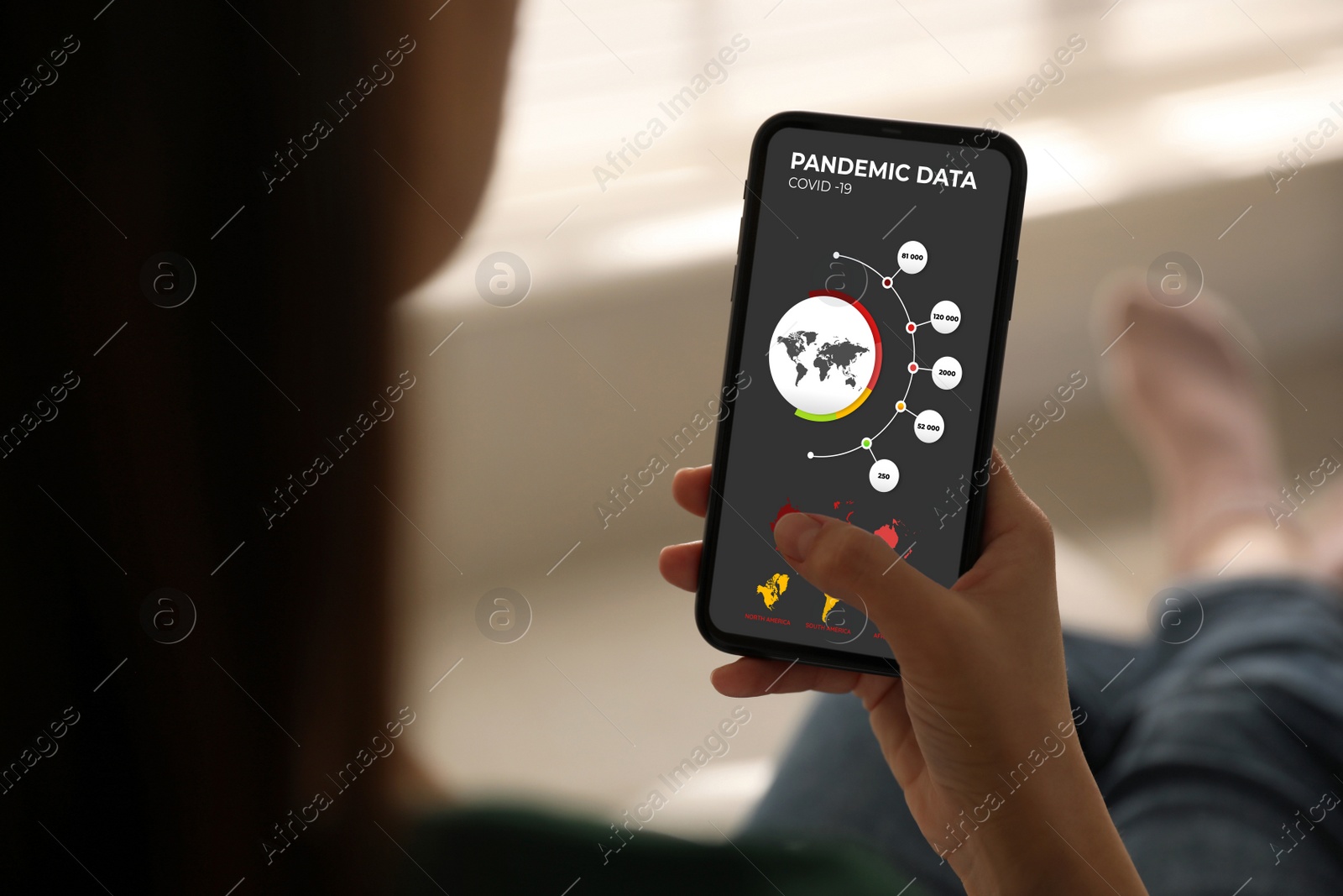 Image of Woman with smartphone checking pandemic data indoors, closeup. Coronavirus outbreak