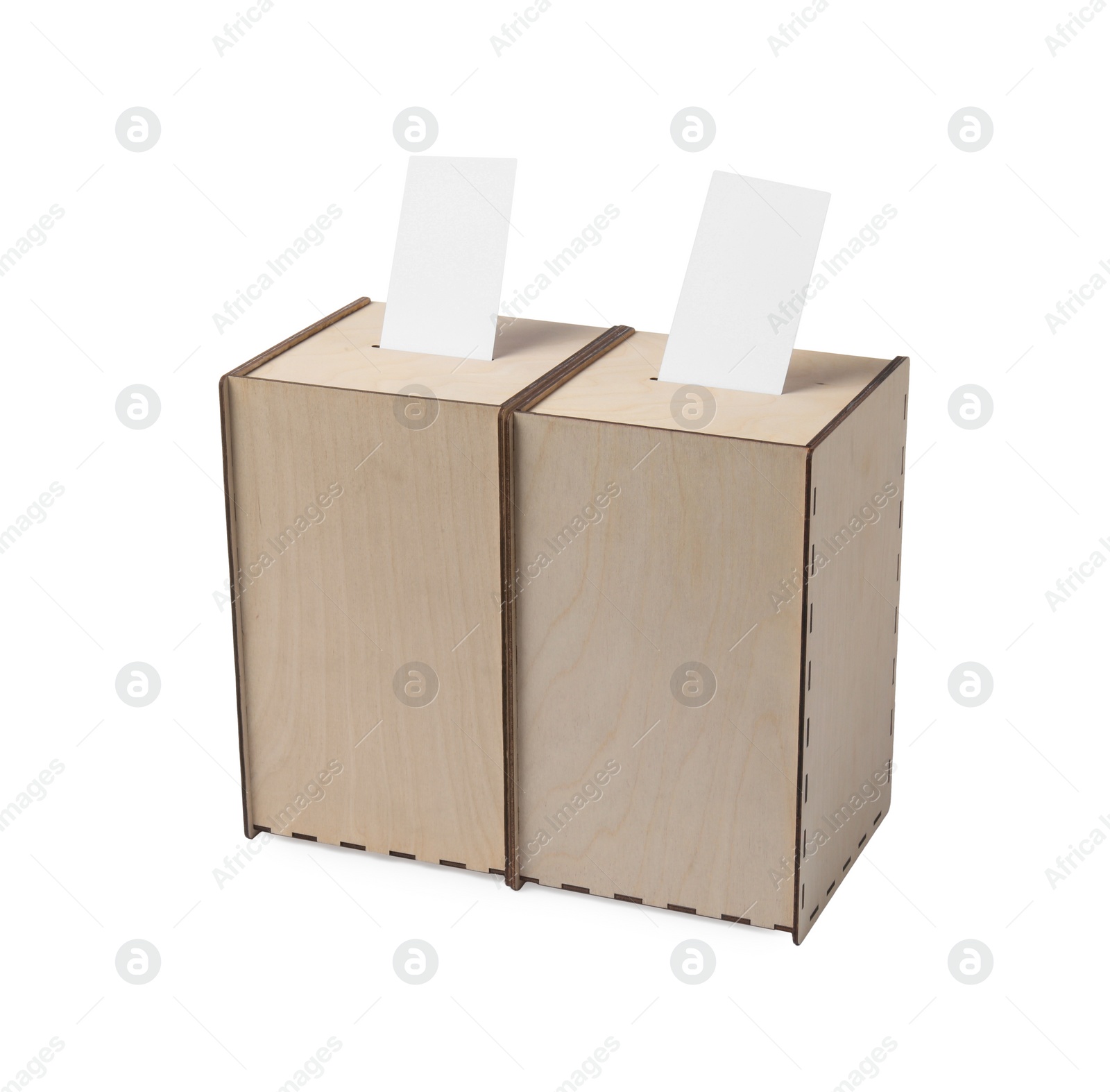 Photo of Wooden ballot boxes with votes isolated on white