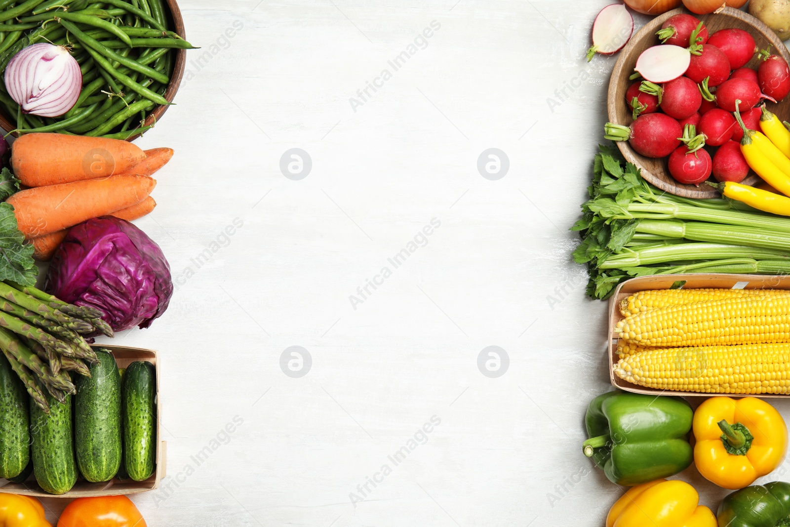 Photo of Flat lay composition with fresh vegetables and space for text on light background