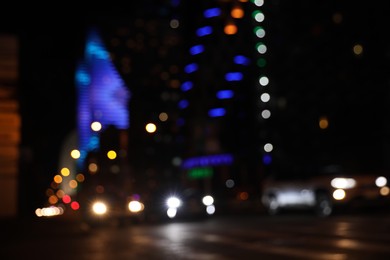 Photo of Blurred view of cityscape with bokeh effect. Night life