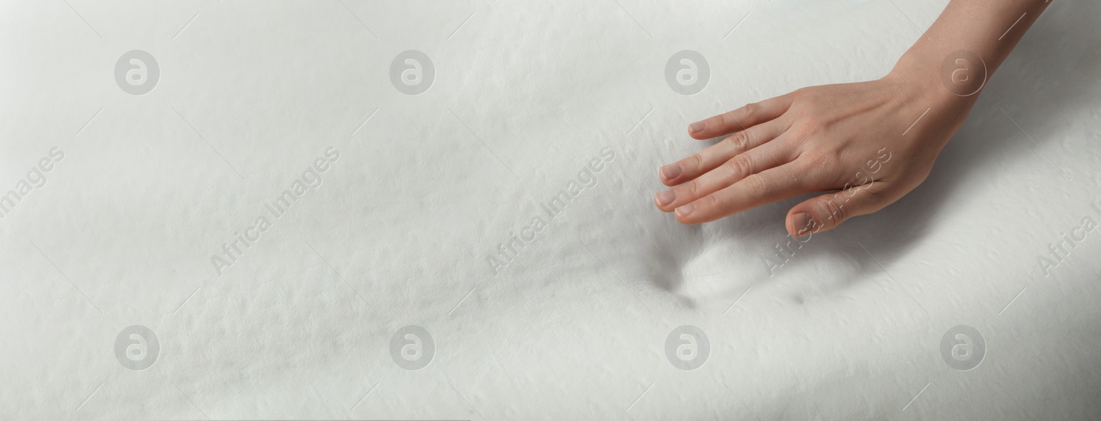 Image of Woman touching memory foam pillow, closeup. Banner design with space for text