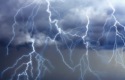 Image of Lightnings in dark cloudy sky during thunderstorm