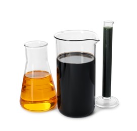 Photo of Beaker, test tube and flask with different types of oil isolated on white