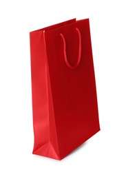 Photo of One red shopping bag isolated on white