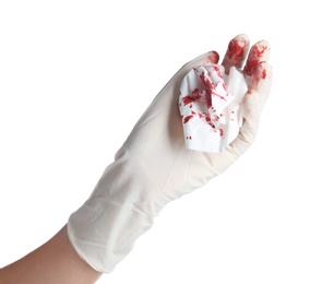 Photo of Doctor in medical glove holding tissue with blood on white background