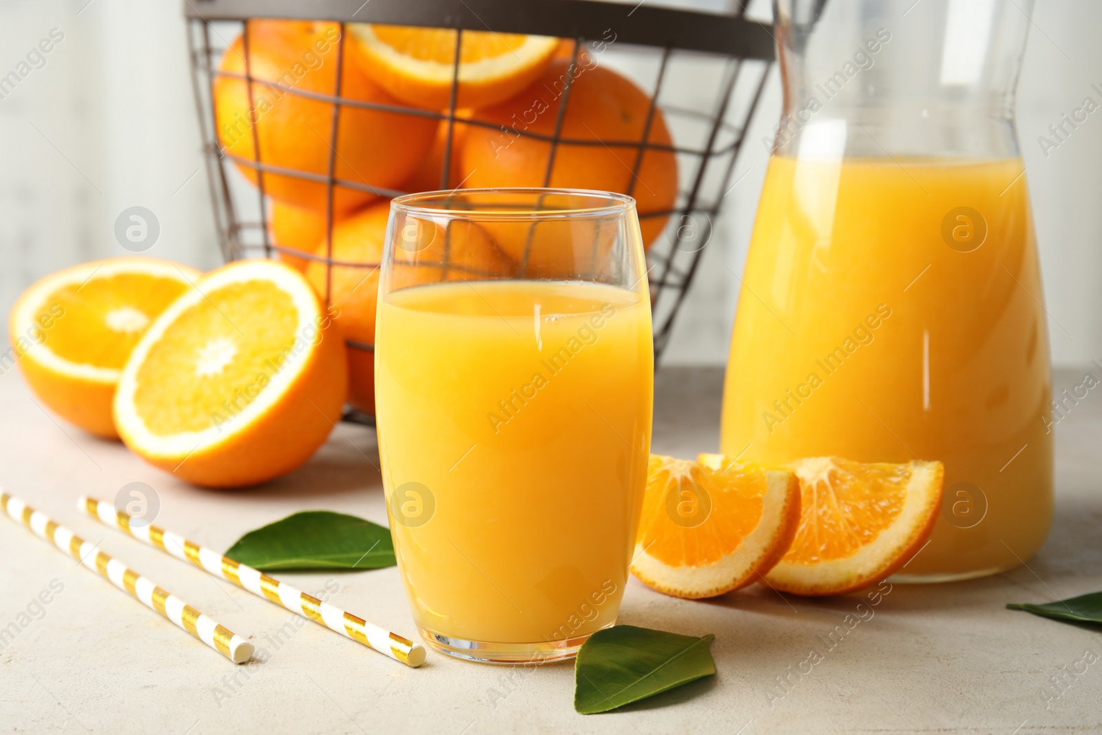 Photo of Composition with orange juice and fresh fruit on table