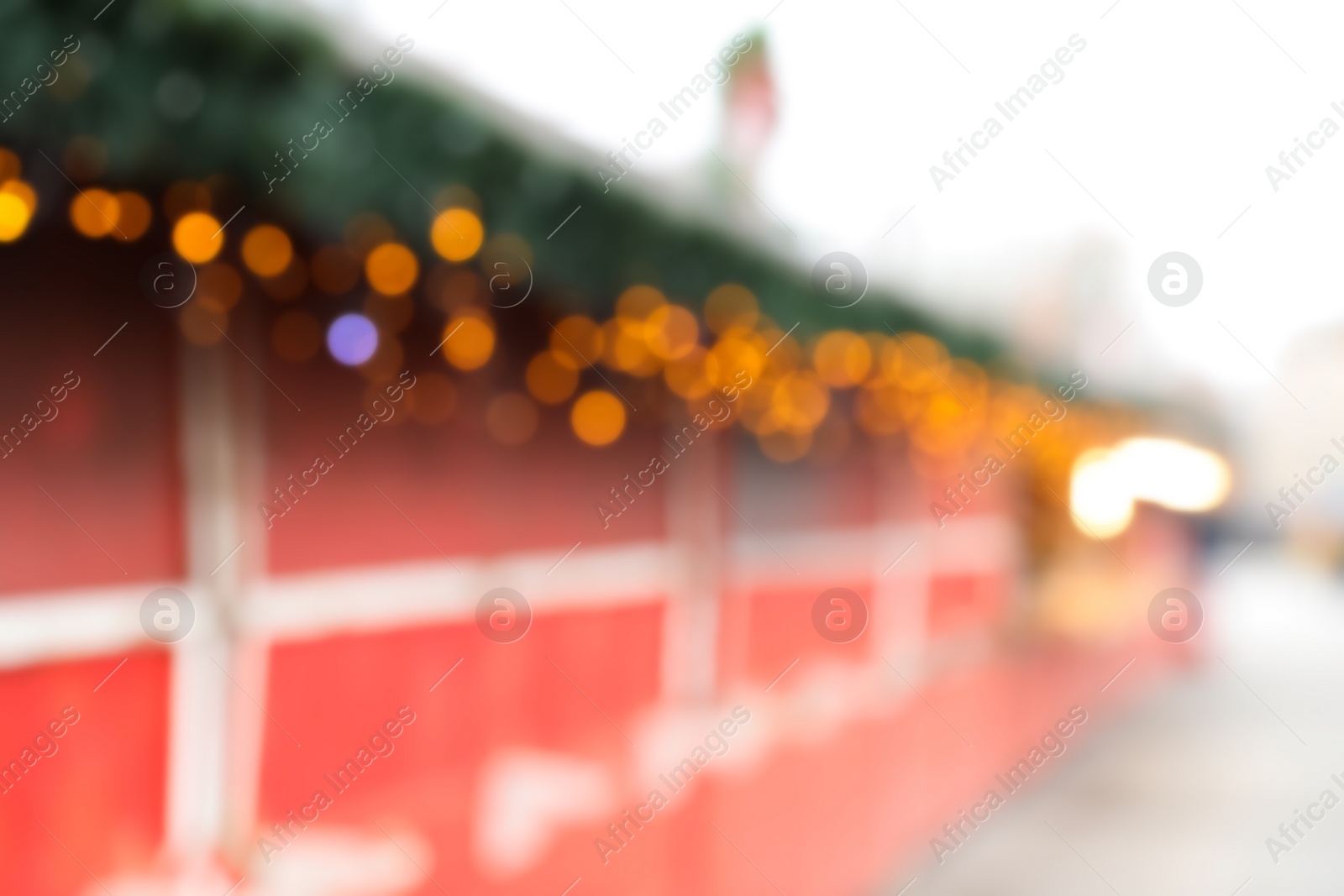 Photo of Blurred view of Christmas fair stalls outdoors