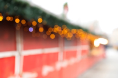 Photo of Blurred view of Christmas fair stalls outdoors