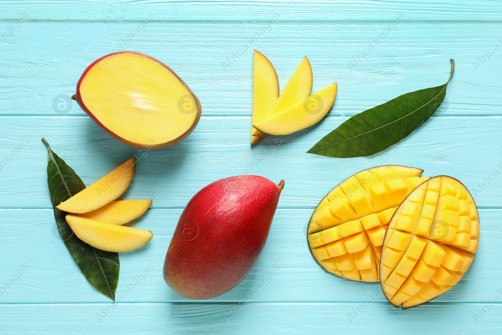 Photo of Flat lay composition with mango on color wooden background