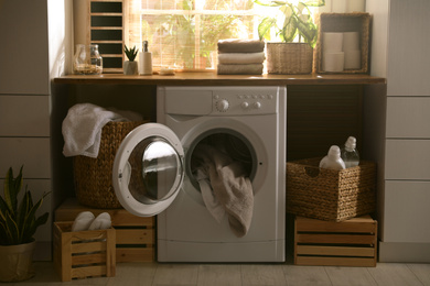 Stylish room interior with washing machine. Design idea