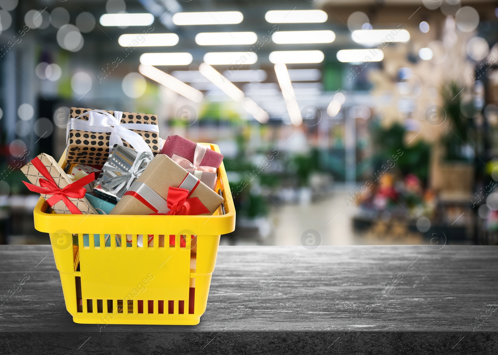 Image of Boxing day concept. Shopping basket with gifts in supermarket, space for text