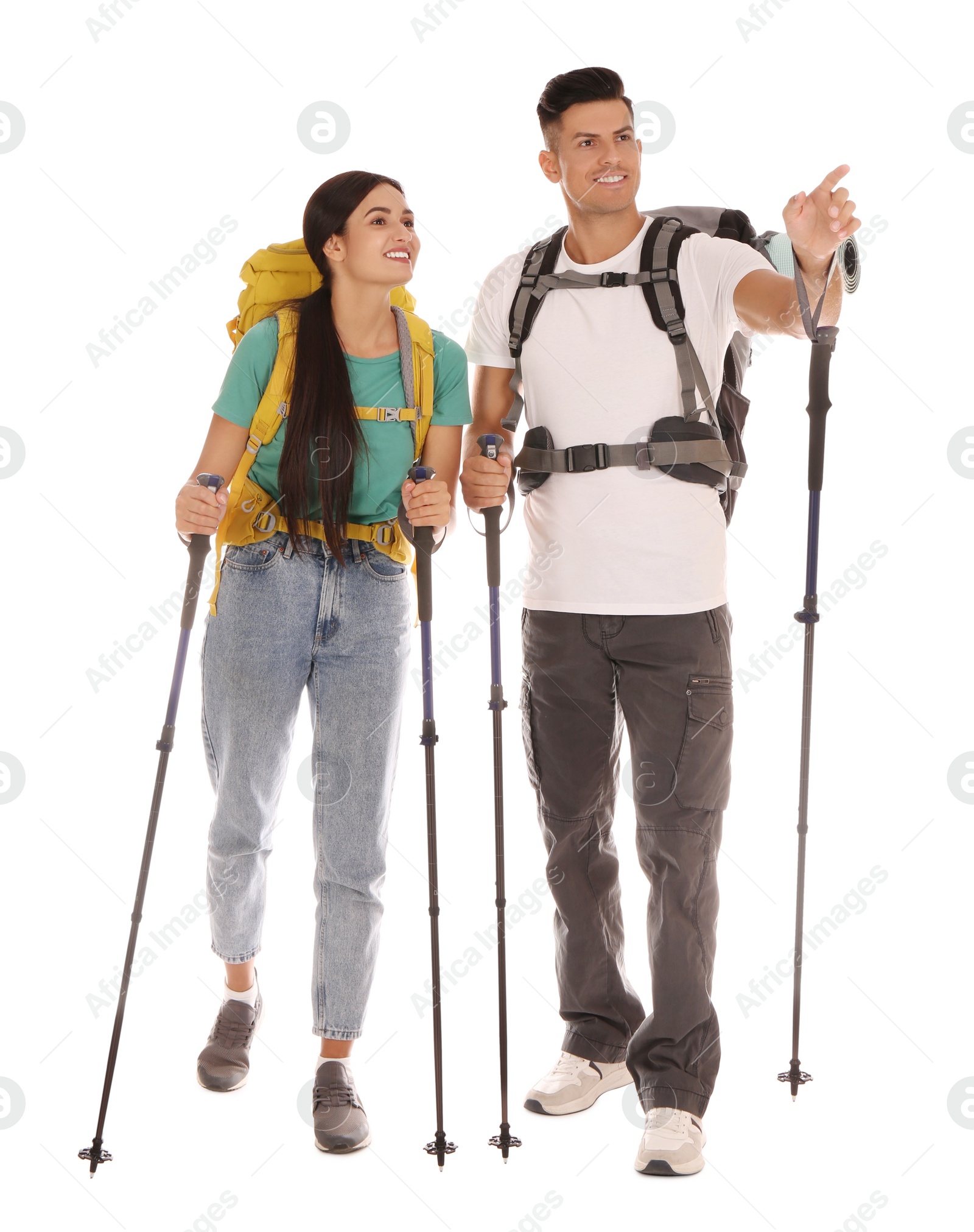 Photo of Couple of hikers with backpacks and trekking poles on white background