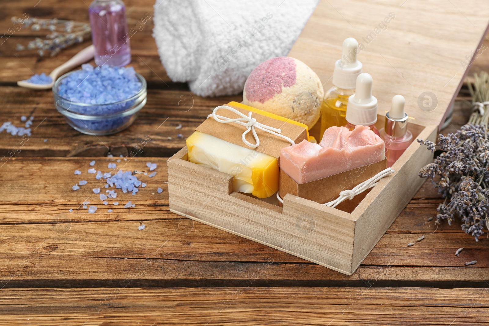 Photo of Natural handmade soap bars in box on wooden background