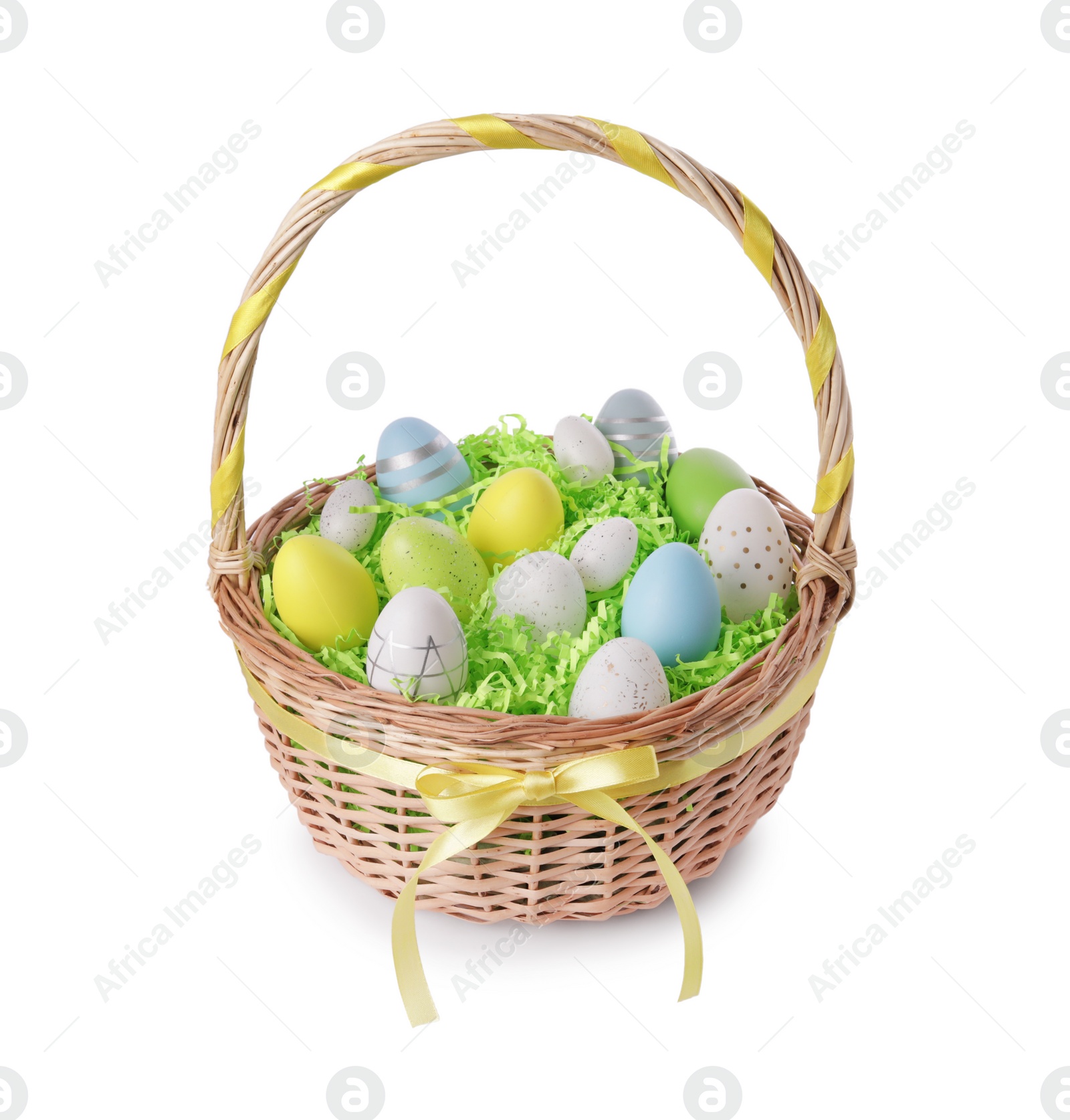 Photo of Wicker basket with beautifully painted Easter eggs isolated on white