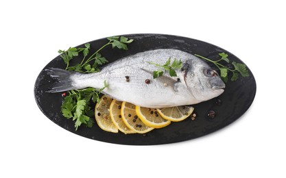 Photo of Raw dorado fish, parsley, lemon slices and peppercorns isolated on white, top view