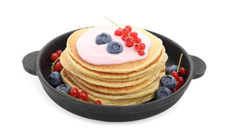 Tasty pancakes with natural yogurt, blueberries and red currants on white background