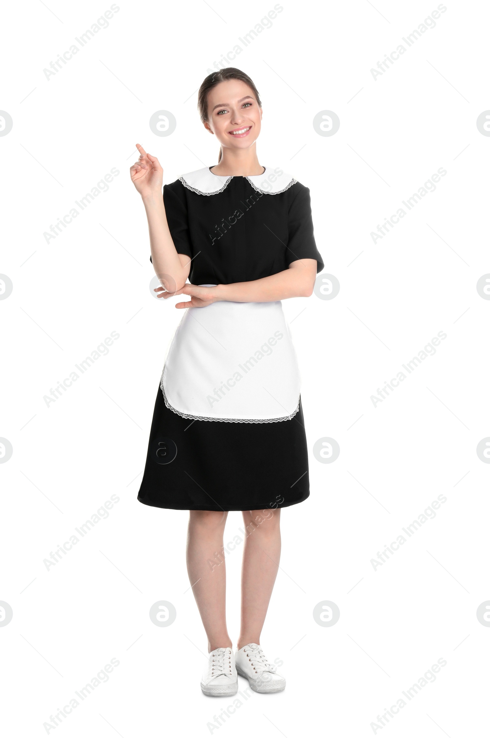 Photo of Young chambermaid in uniform on white background