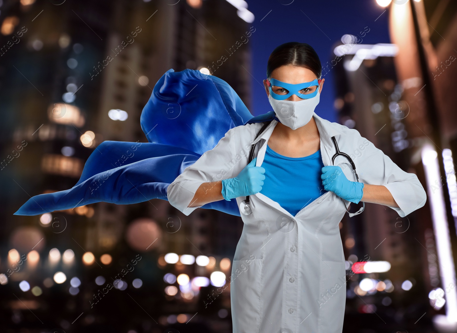 Image of Doctor dressed as superhero on night city background. Medical workers fighting with dangerous diseases