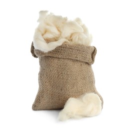 Photo of Soft wool and sack on white background