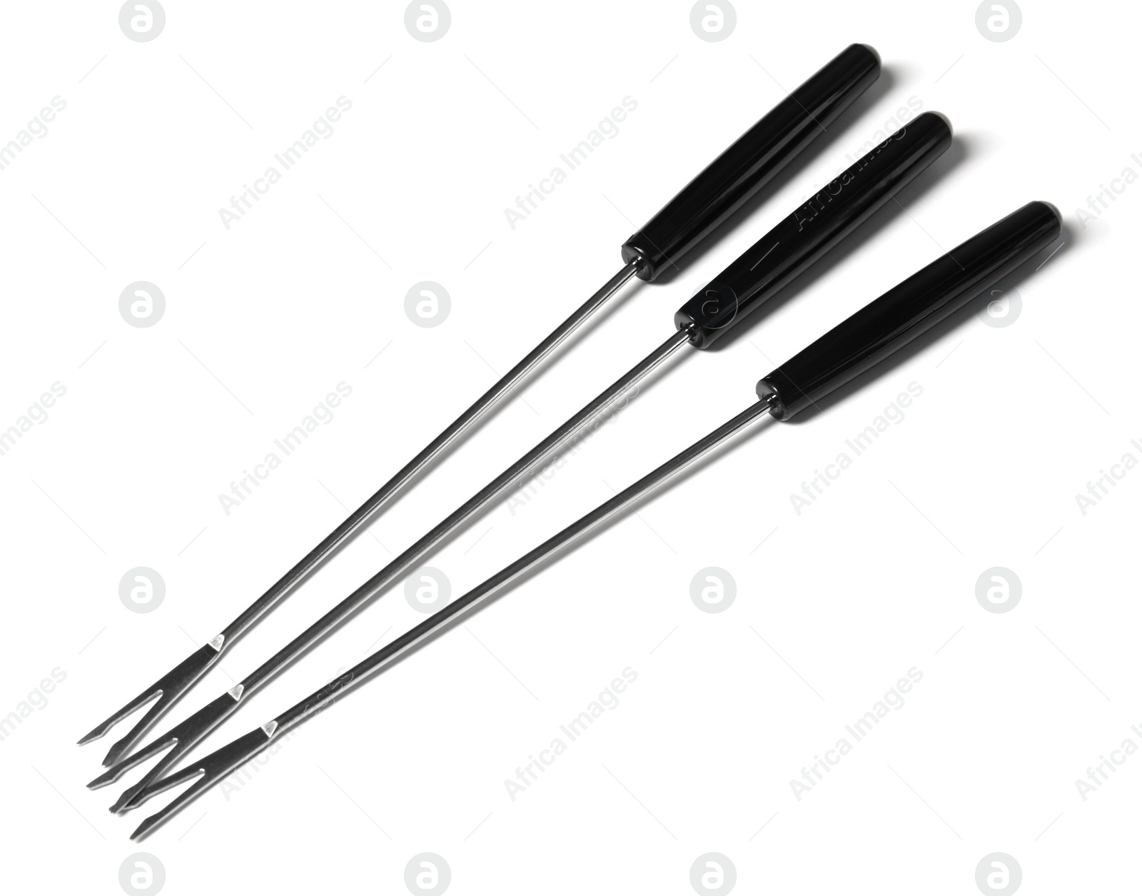 Photo of Set of fondue forks on white background. Kitchen equipment