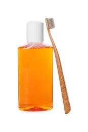 Photo of Bottle of mouthwash and toothbrush isolated on white