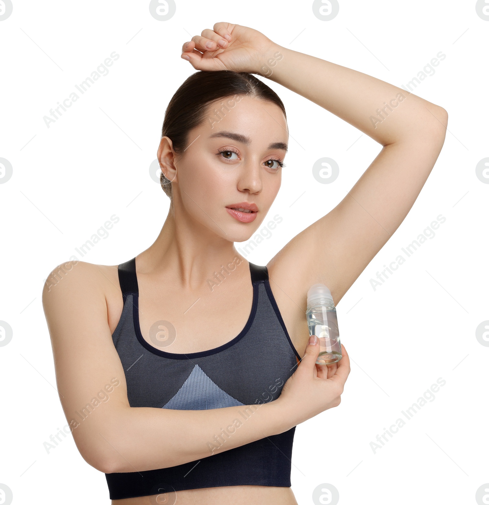 Photo of Beautiful woman applying deodorant on white background