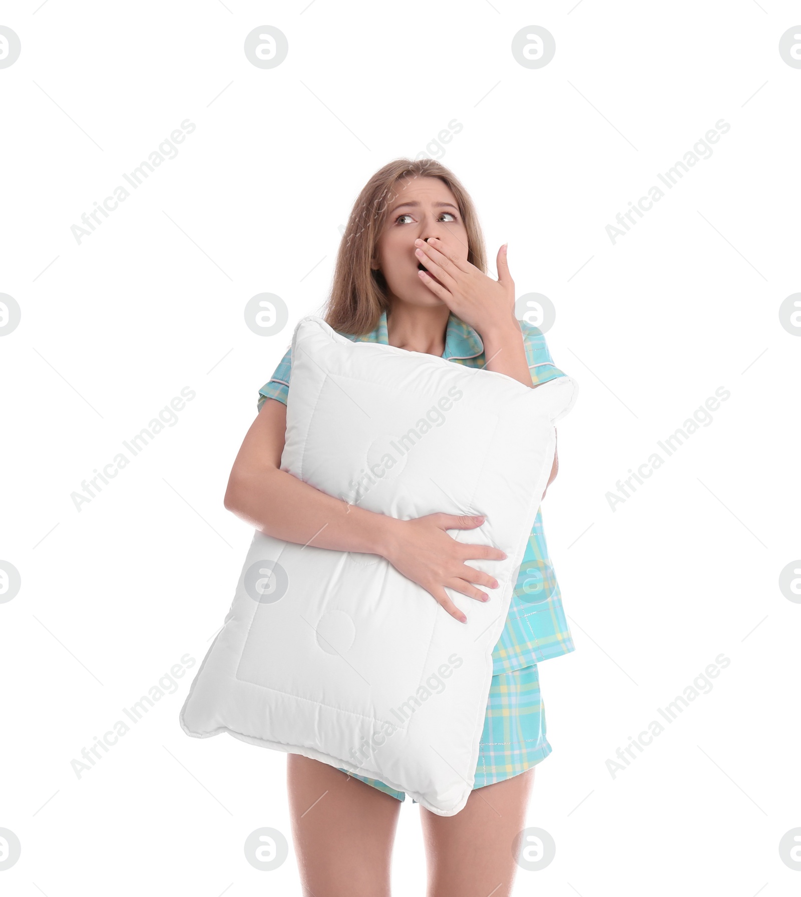 Photo of Young woman in pajamas with pillow on white background