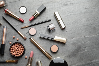 Photo of Set of luxury makeup products on grey background, flat lay