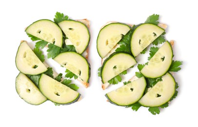 Tasty sandwiches with cucumber and parsley on white background, top view