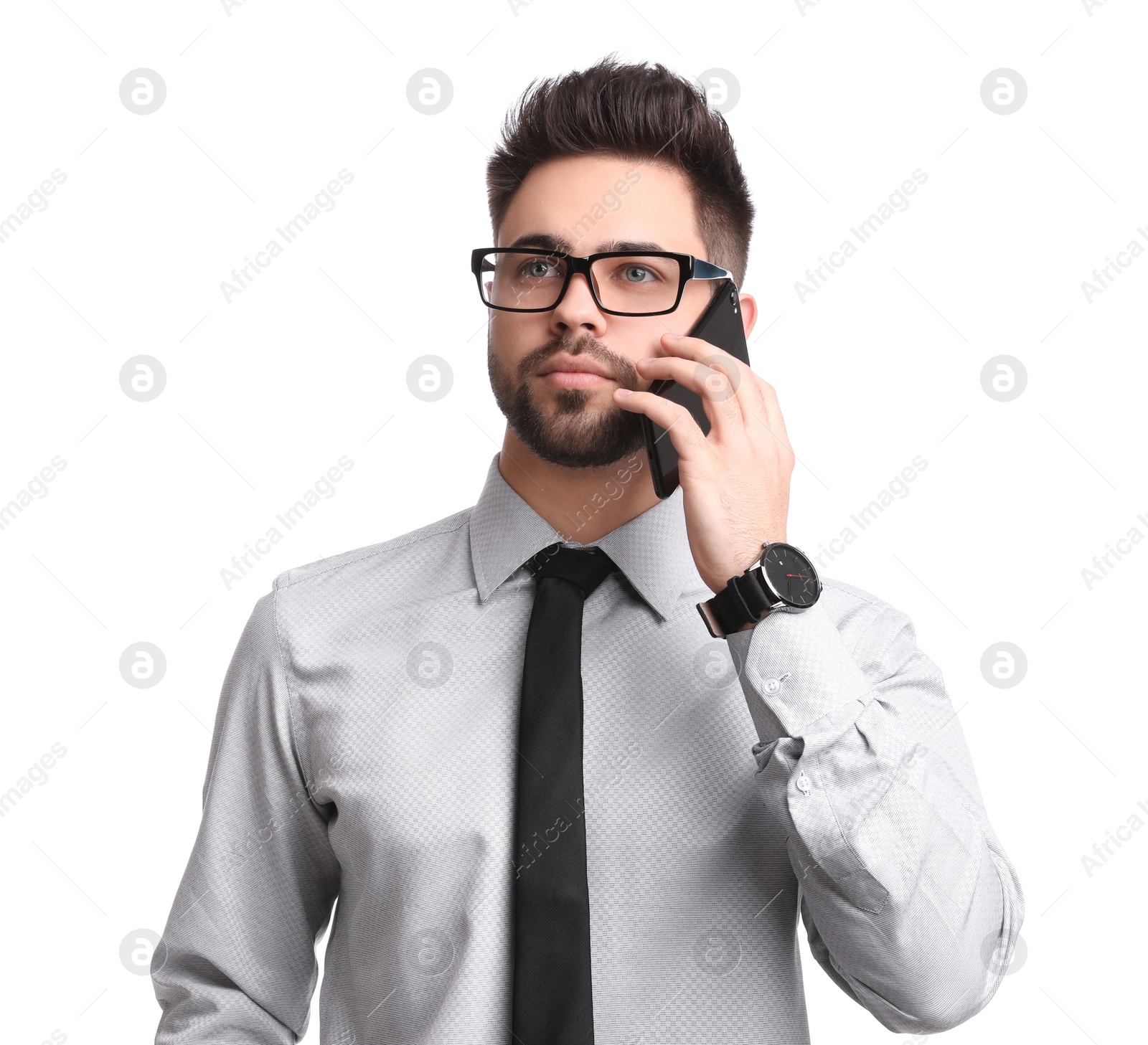 Photo of Young businessman talking on smartphone against white background