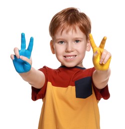 Photo of Little boy with hands painted in Ukrainian flag colors on white background. Love Ukraine concept