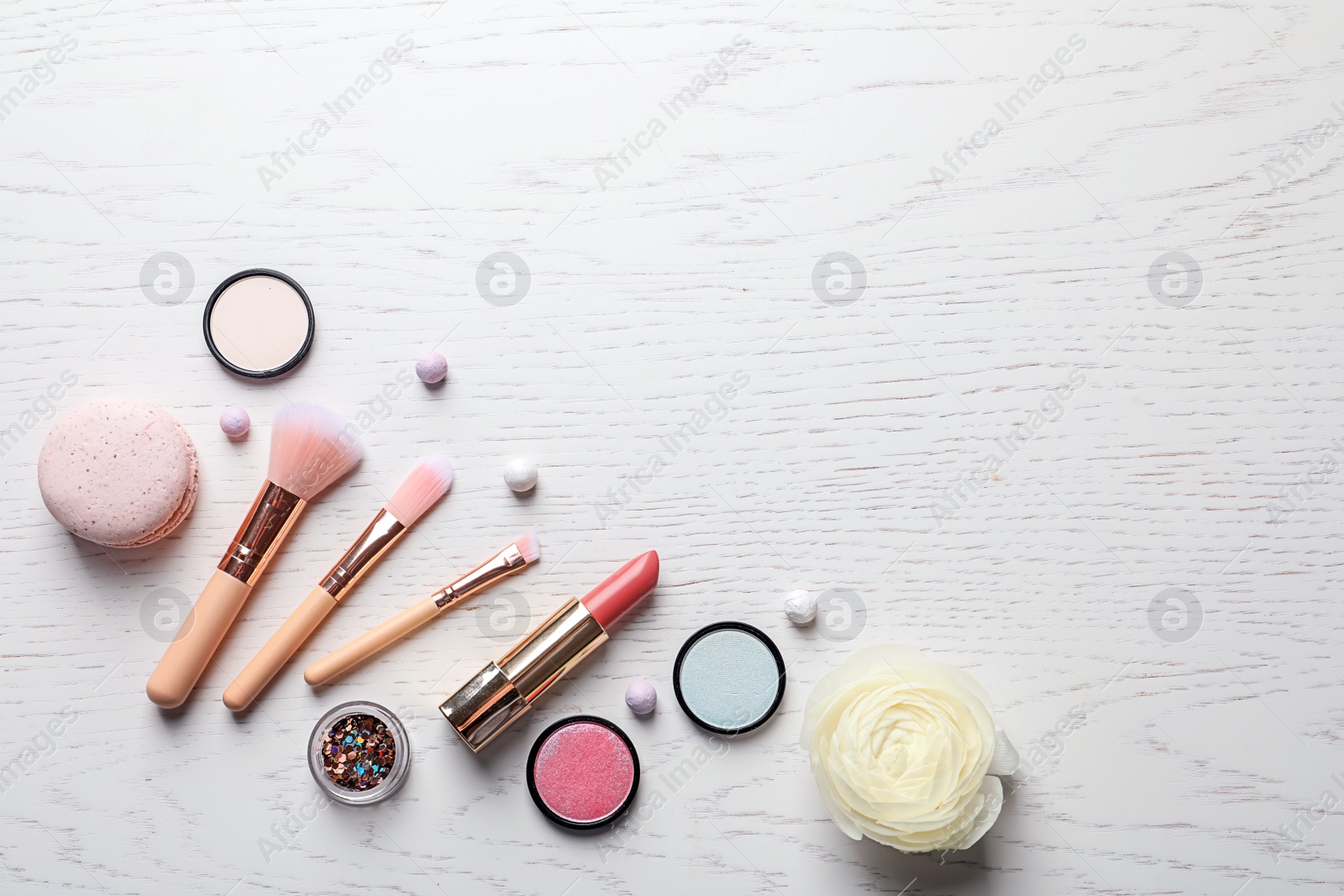 Photo of Flat lay composition with decorative cosmetics on light background