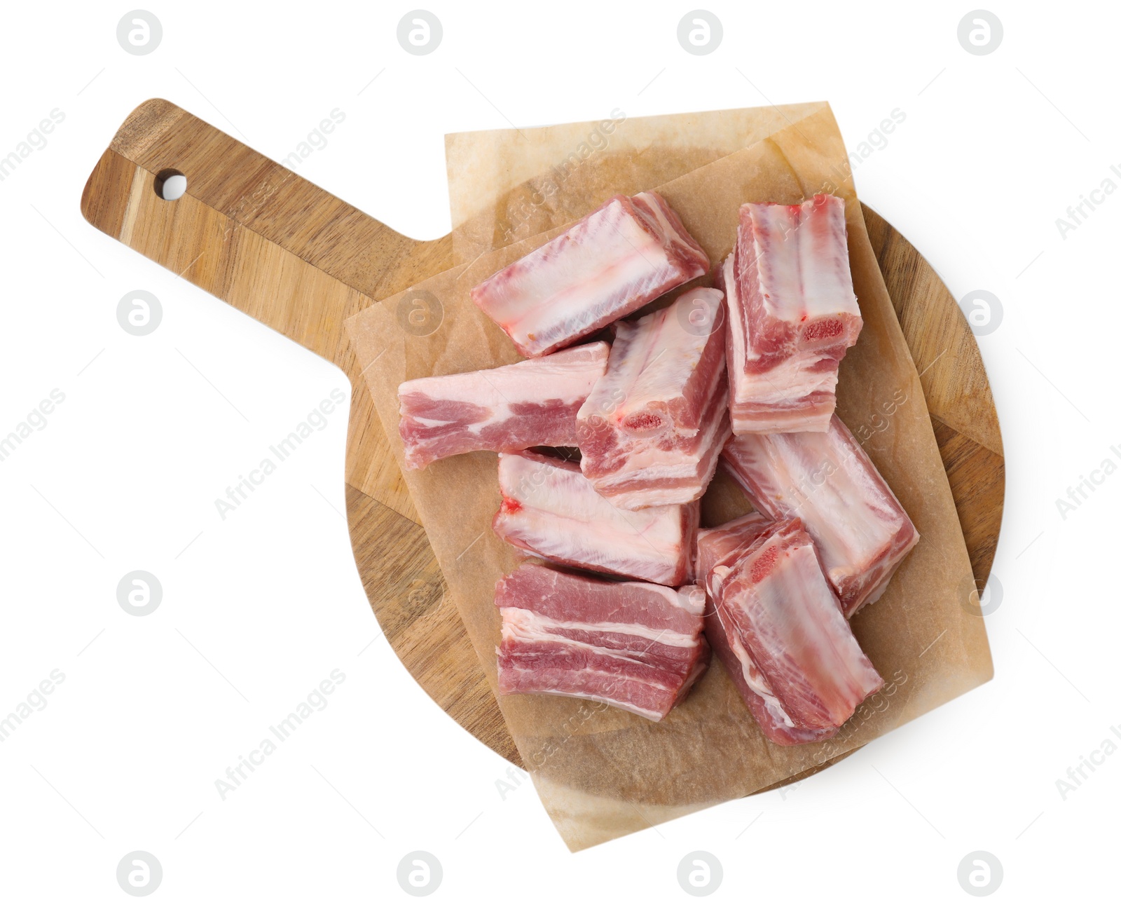 Photo of Cut raw pork ribs isolated on white, top view