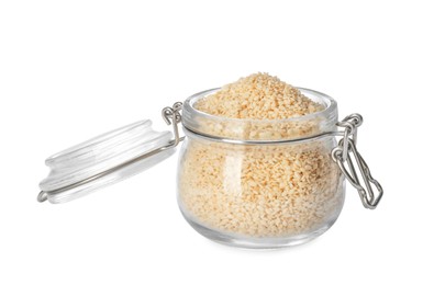 Photo of Glass jar with sesame seeds on white background